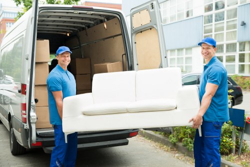 Removal van and movers preparing a house move in Crossness