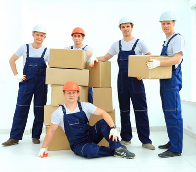Commercial removals team transporting office equipment in Crossness