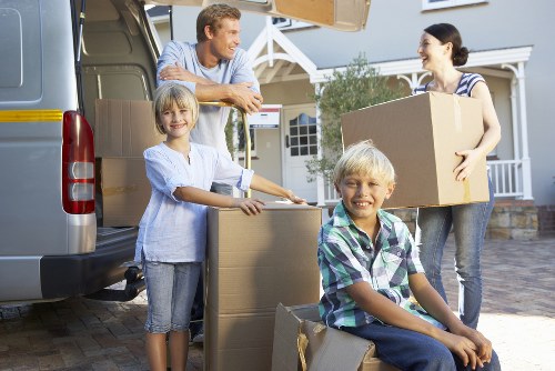 Loading furniture and household items into a van in Crossness